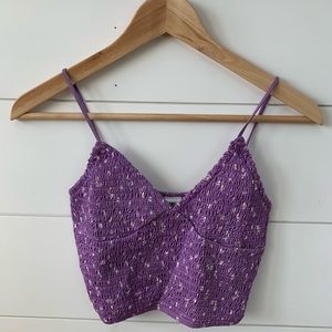 A cute purple tank top with floral design.